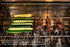 Zucchini on the grill beside beef skewers cooking over a Tucker R Class BBQ charcoal tray