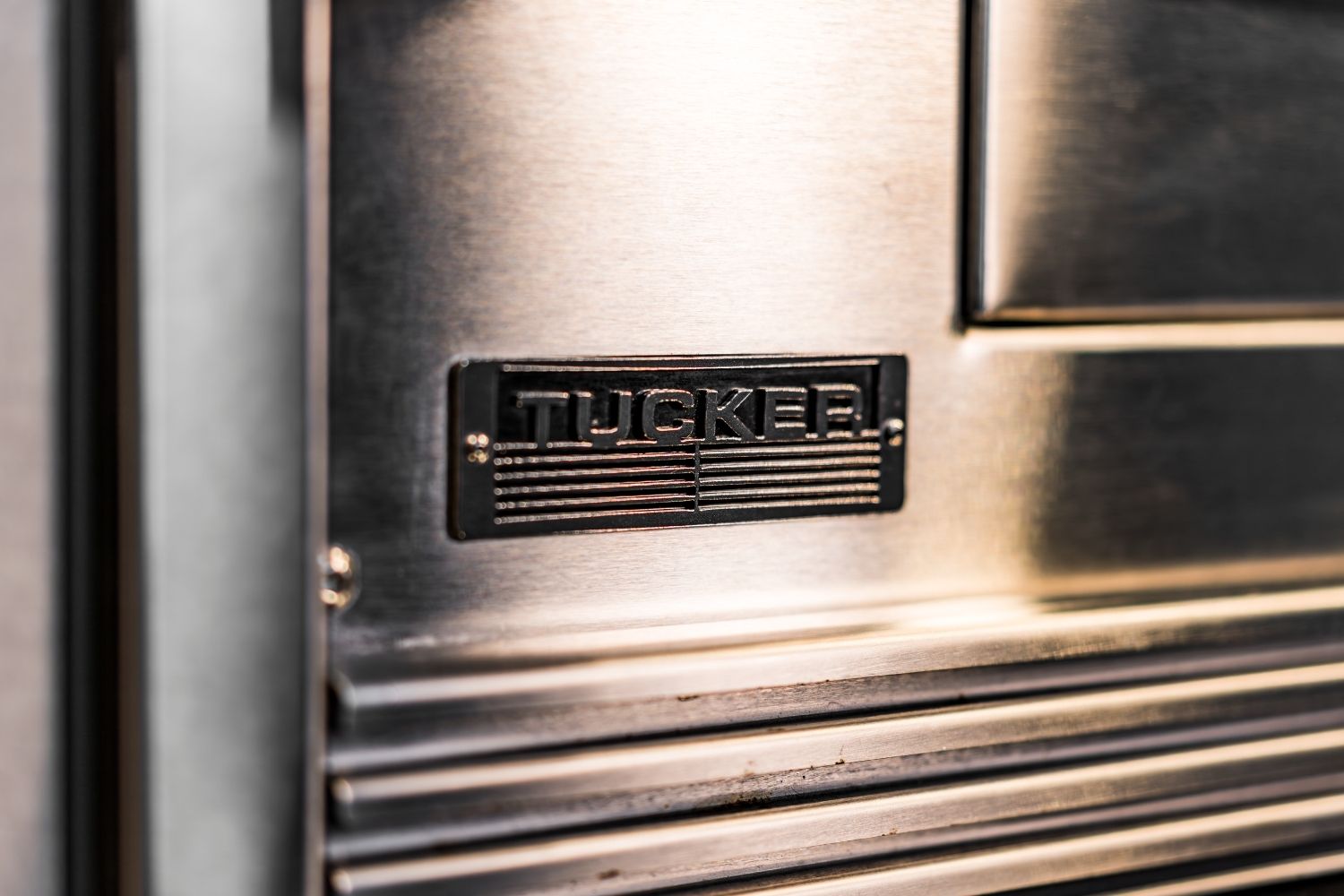 Tucker Charcoal Deluxe Pro Logo Close-up